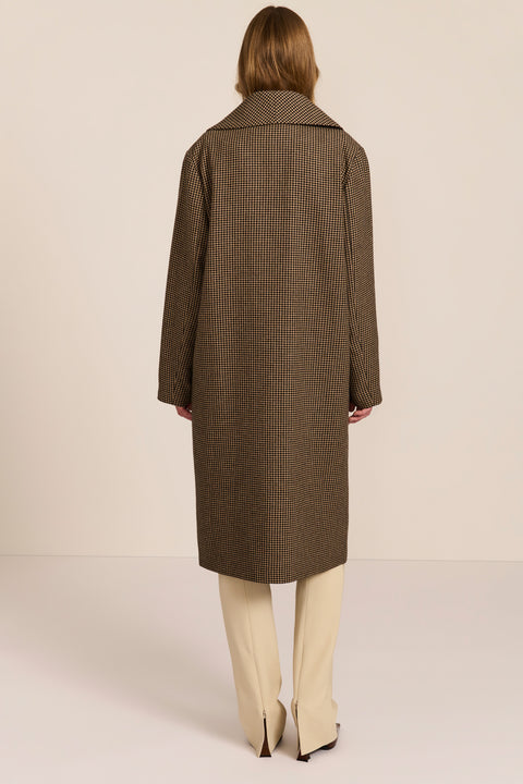 Women's brown houndstooth long coat with oversized notched collar, two-button closure and welt pockets.