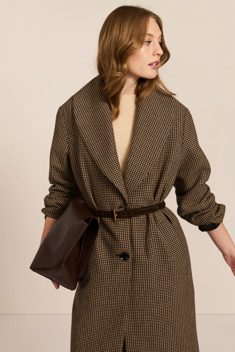 Women's brown houndstooth long coat with oversized notched collar, two-button closure and welt pockets.