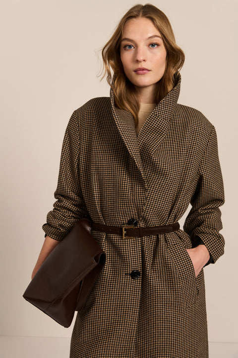 Women's brown houndstooth long coat with oversized notched collar, two-button closure and welt pockets.