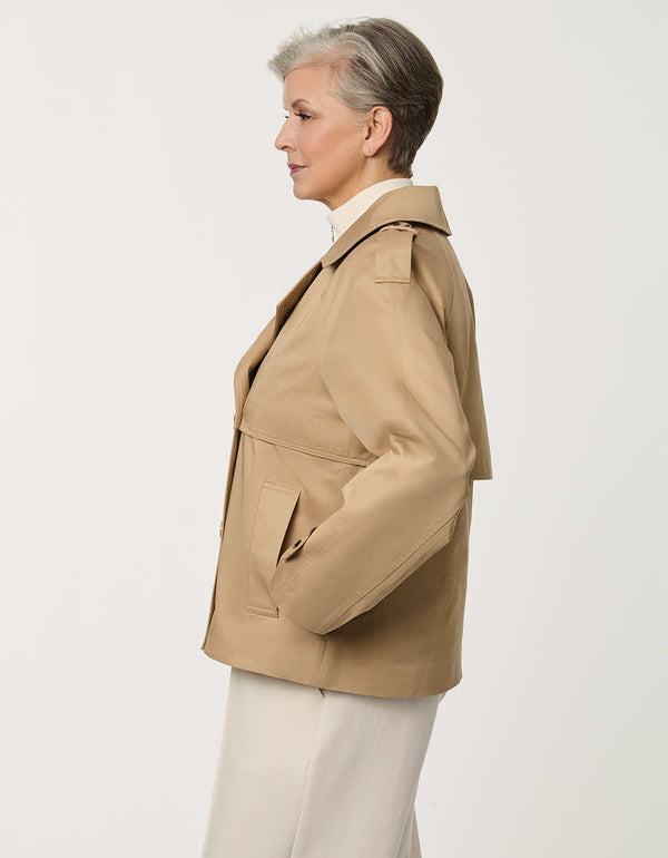 Women’s cropped double-breasted trench jacket with a relaxed fit, designed for spring layering.