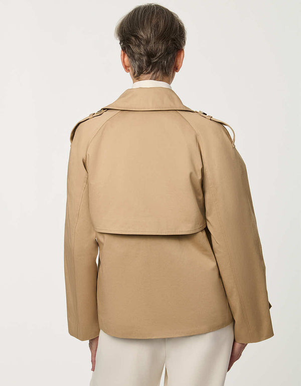 Women’s cropped double-breasted trench jacket with a relaxed fit, designed for spring layering.