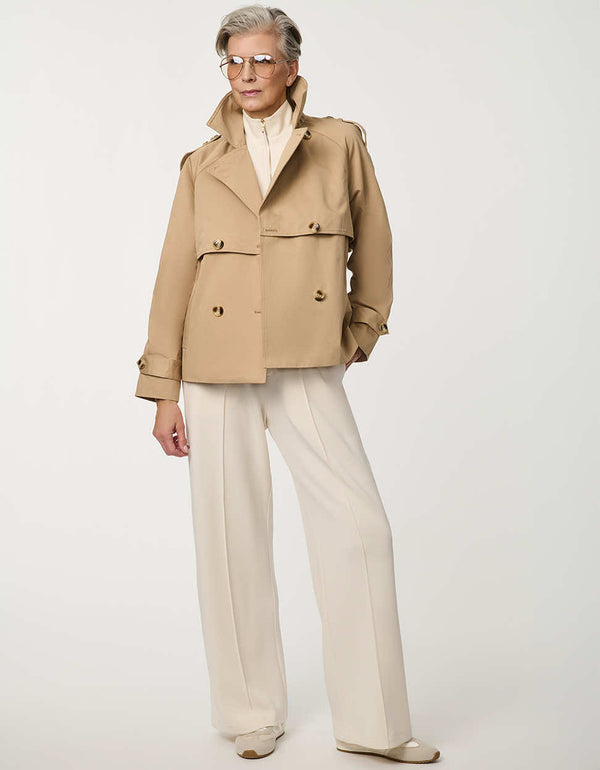 Women’s cropped double-breasted trench jacket with a relaxed fit, designed for spring layering.
