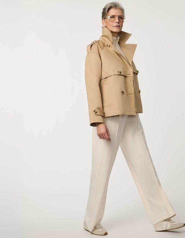 Women’s cropped double-breasted trench jacket with a relaxed fit, designed for spring layering.