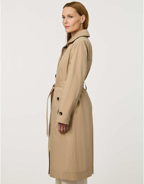 Women’s lightweight utility trench coat with belted waist, flap pockets, and roll-away hood tucked into the collar.