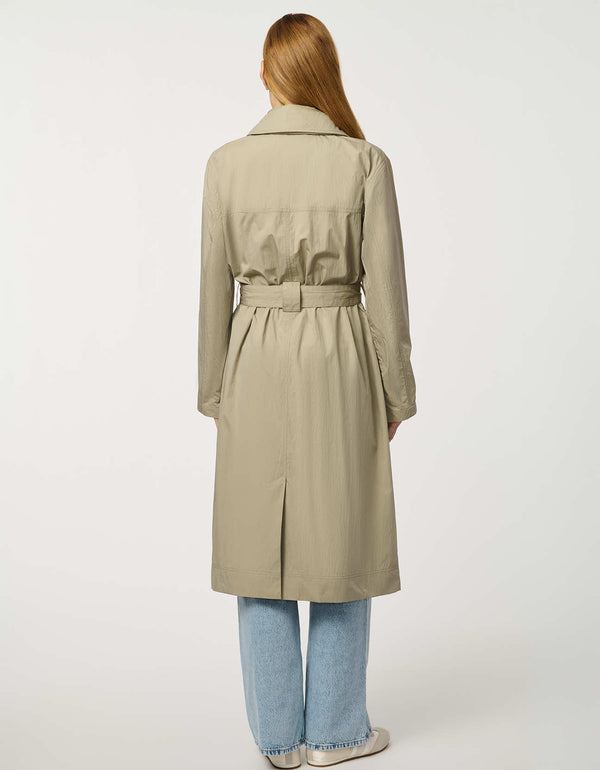 Women’s lightweight utility trench coat with belted waist, flap pockets, and roll-away hood tucked into the collar.