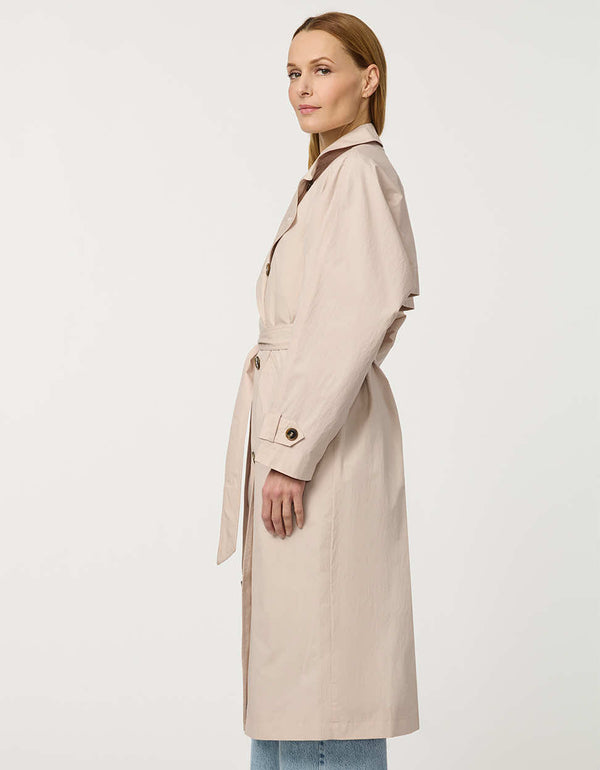 Women’s double-breasted trench coat with belted waist, cuff tabs, and striped interior lining.