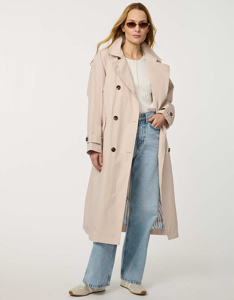 Women’s double-breasted trench coat with belted waist, cuff tabs, and striped interior lining.