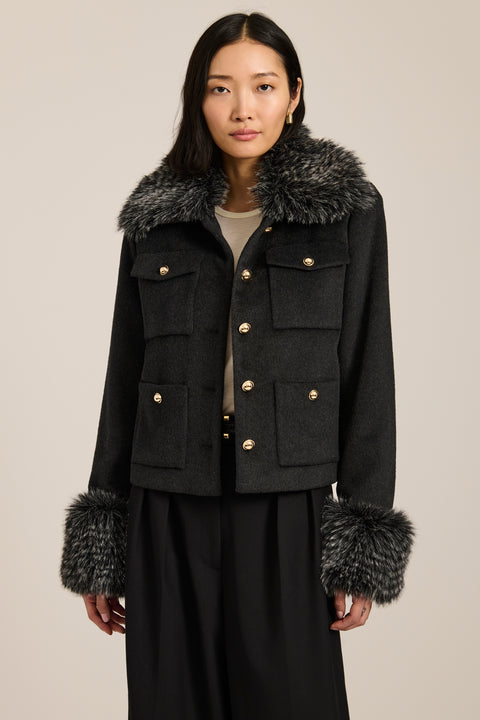Wool-blend jacket with removable faux fur collar and cuffs, gold-tone buttons and four flap pockets.