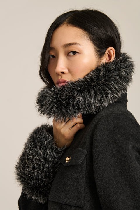 Wool-blend jacket with removable faux fur collar and cuffs, gold-tone buttons and four flap pockets.