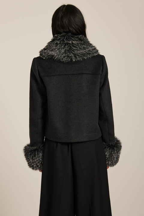 Wool-blend jacket with removable faux fur collar and cuffs, gold-tone buttons and four flap pockets.