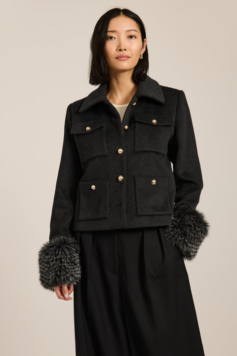 Wool-blend jacket with removable faux fur collar and cuffs, gold-tone buttons and four flap pockets.