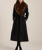 Long belted wool-blend coat with removable faux fur shawl collar, double-breasted front and tailored silhouette.
