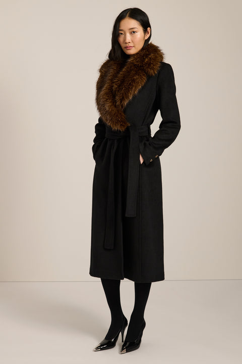 Long belted wool-blend coat with removable faux fur shawl collar, double-breasted front and tailored silhouette.