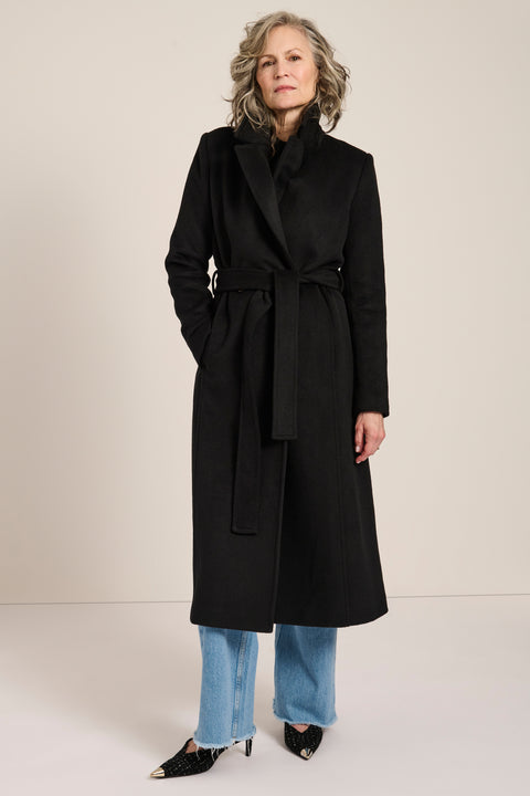 Long belted wool-blend coat with removable faux fur shawl collar, double-breasted front and tailored silhouette.