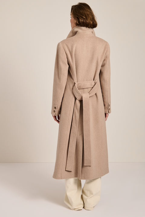 Long belted wool-blend coat with removable faux fur shawl collar, double-breasted front and tailored silhouette.