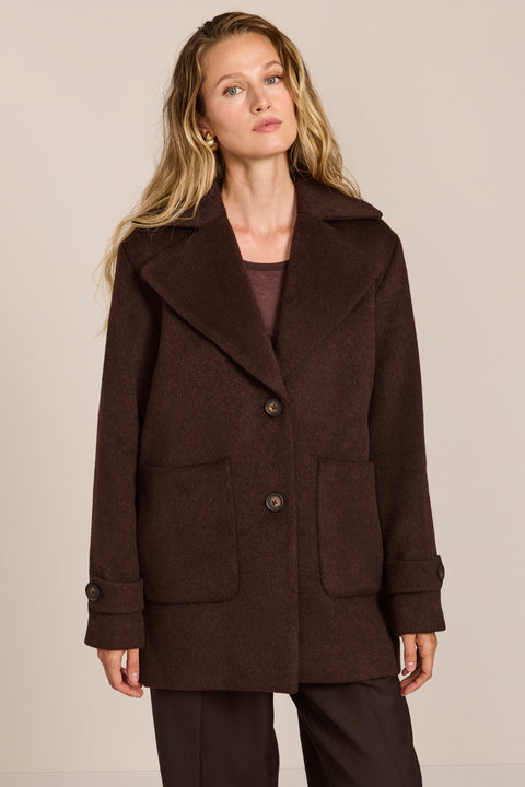Women's chocolate brown oversized wool-blend coat with notched lapels, patch pockets and button-tab cuffs.