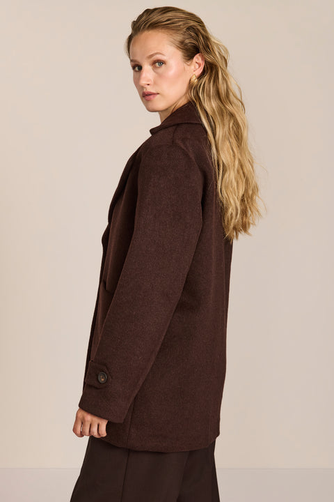 Women's chocolate brown oversized wool-blend coat with notched lapels, patch pockets and button-tab cuffs.