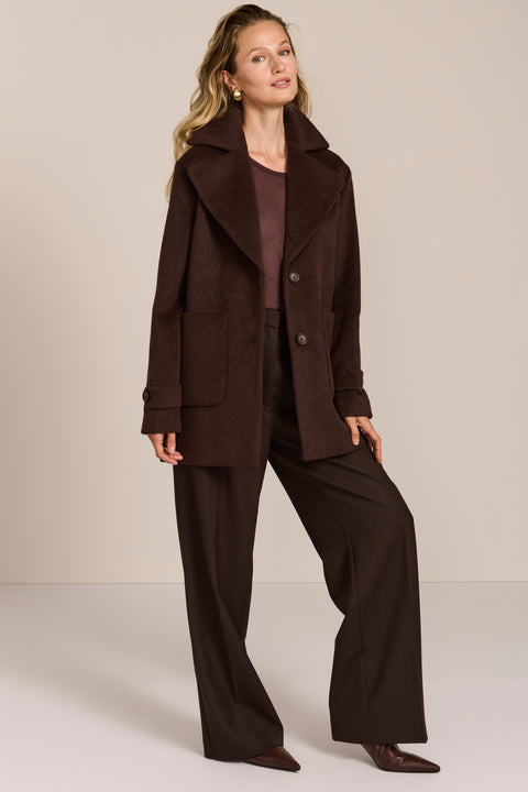 Women's chocolate brown oversized wool-blend coat with notched lapels, patch pockets and button-tab cuffs.