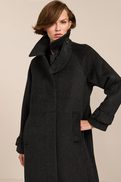Women's long wool coat featuring a sculptural stand collar, concealed front closure, patch pockets, and button-tab cuffs.