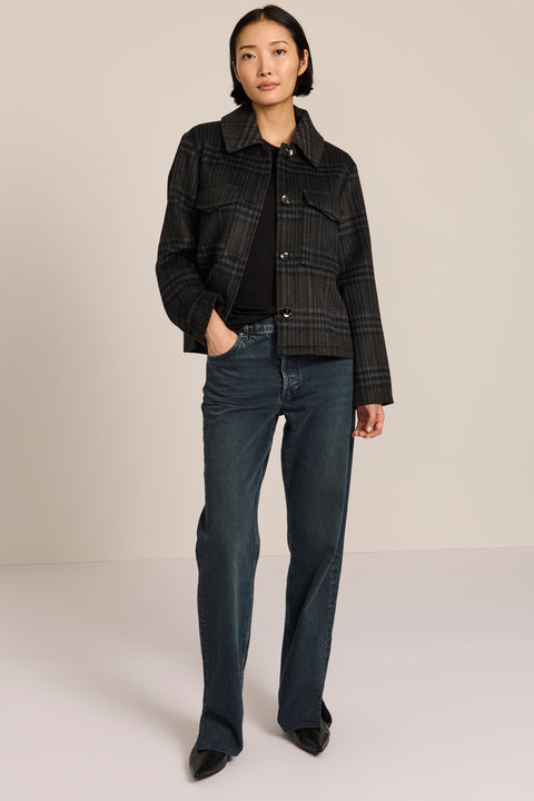 women's cropped plaid wool jacket featuring a point collar, button-front closure, and oversized flap pockets.