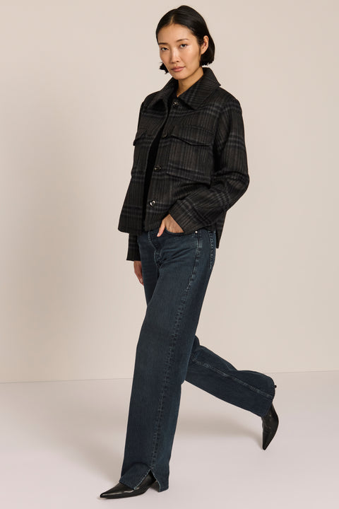 women's cropped plaid wool jacket featuring a point collar, button-front closure, and oversized flap pockets.