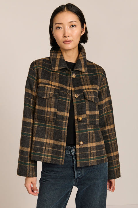 women's cropped plaid wool jacket featuring a point collar, button-front closure, and oversized flap pockets.