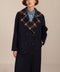 women's double-breasted wool coat with an oversized plaid notched collar, contrasting plaid interior and side pockets.