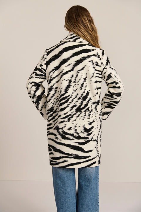 women's tiger print wool coat featuring a streamlined silhouette, pointed collar, concealed front closure and side pockets.