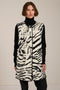 Long Bengal-inspired faux fur vest with collarless silhouette, faux leather trim and elongated fit.