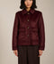 Women's faux calf hair jacket with utility pockets and button-front closure.