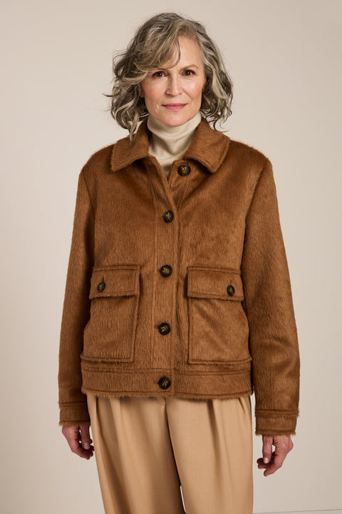 Women's faux calf hair jacket with utility pockets and button-front closure.