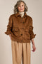 Women's faux calf hair jacket with utility pockets and button-front closure.