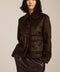 Women's faux calf hair jacket with utility pockets and button-front closure.