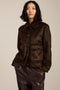 Women's faux calf hair jacket with utility pockets and button-front closure.