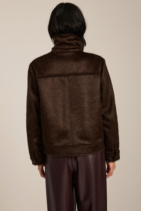 Women's faux calf hair jacket with utility pockets and button-front closure.