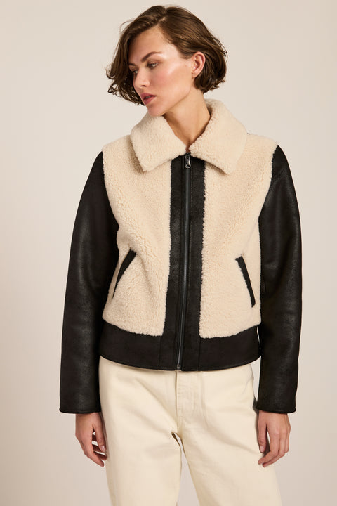 Women's faux shearling and faux leather jacket with zip front and oversized collar in ivory and black