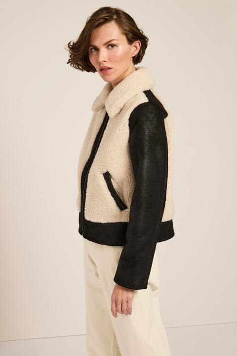 Women's faux shearling and faux leather jacket with zip front and oversized collar in ivory and black