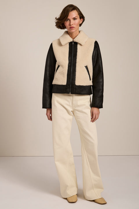 Women's faux shearling and faux leather jacket with zip front and oversized collar in ivory and black