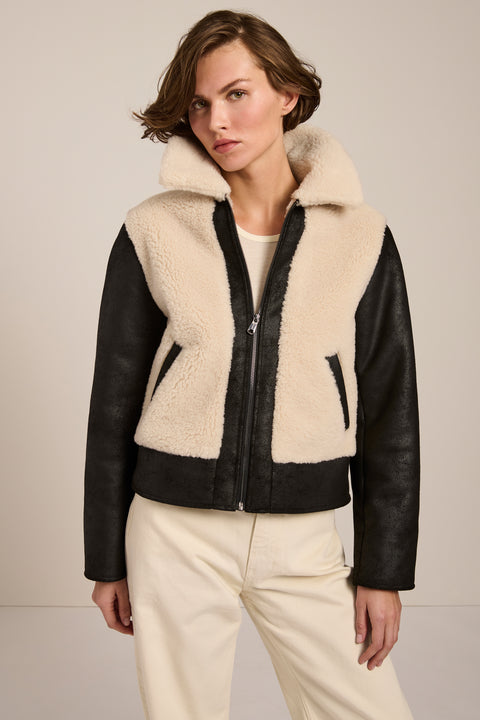 Women's faux shearling and faux leather jacket with zip front and oversized collar in ivory and black