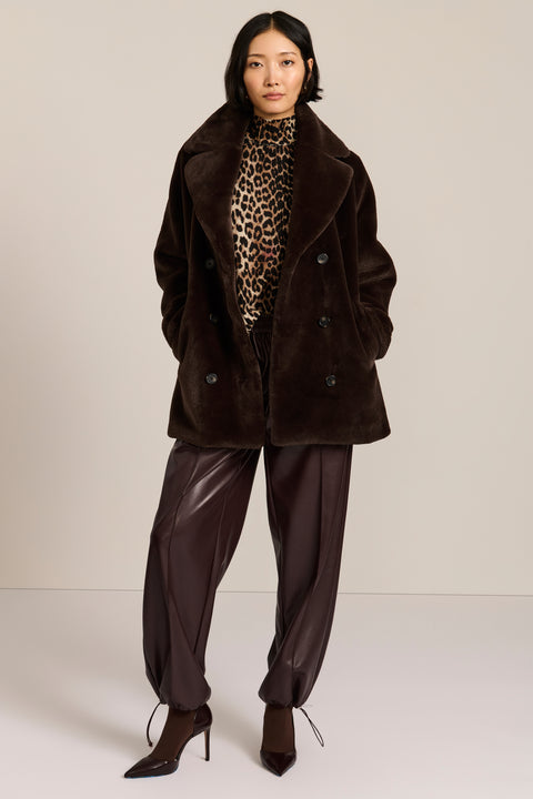 women's dark brown double-breasted faux fur coat with an oversized notched collar, button front, and angled pockets.