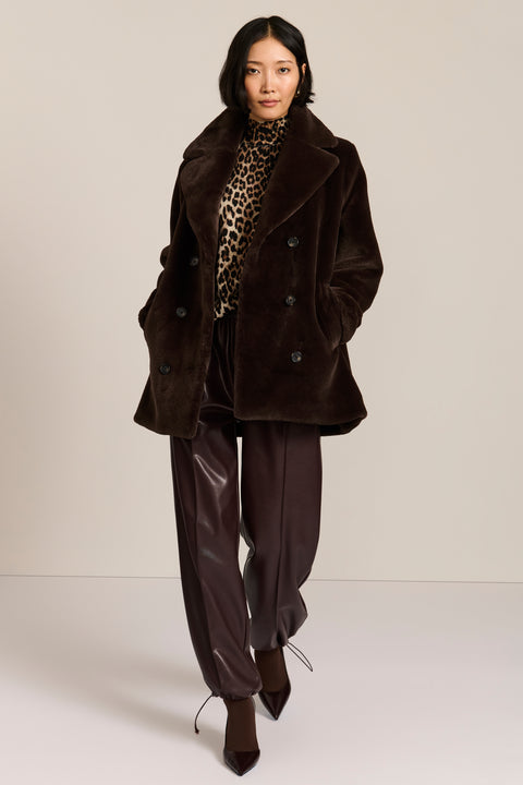 women's dark brown double-breasted faux fur coat with an oversized notched collar, button front, and angled pockets.