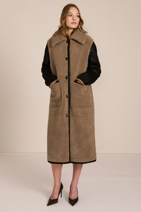 women's Mixed Media Faux Shearling Coat in taupe with black faux leather contrast sleeves, oversized collar and longline silhouette.