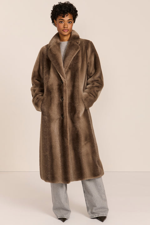 women's long taupe faux fur coat with a wide notched collar, single-breasted front, and side pockets.