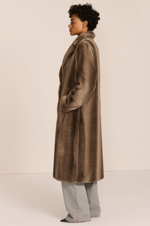 women's long taupe faux fur coat with a wide notched collar, single-breasted front, and side pockets.