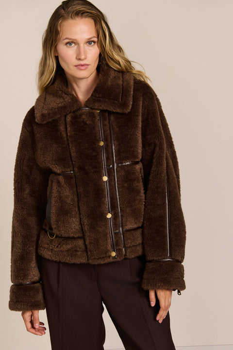 women's Faux Shearling Utility Jacket in chocolate brown with contrast piping, oversized collar and patch pockets.