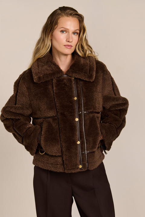women's Faux Shearling Utility Jacket in chocolate brown with contrast piping, oversized collar and patch pockets.