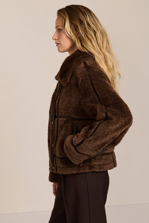 women's Faux Shearling Utility Jacket in chocolate brown with contrast piping, oversized collar and patch pockets.