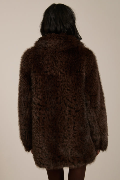 Spotted faux fur coat with oversized notch collar, button-front closure and patch pockets with side entry.