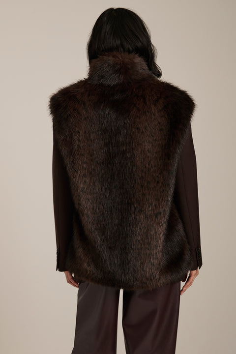 Women's faux fur vest with toggle closures, stand collar, and side pockets.