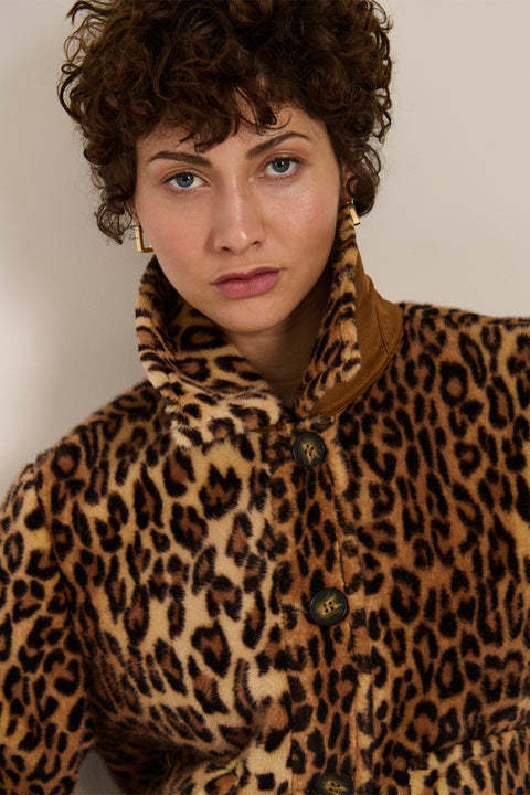 Leopard print faux fur utility jacket with faux suede collar, oversized flap pockets and relaxed silhouette.
